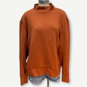 The ARRIVALS orange mock neck‎ sweater